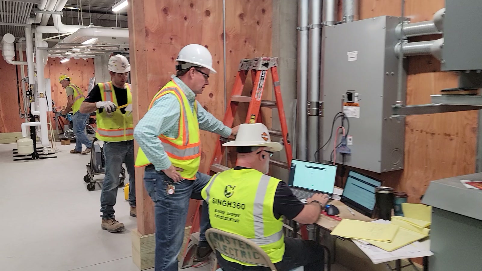 Singh360 commissioning team reviewing controls and test records at a new facility